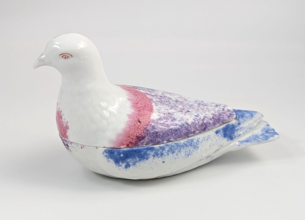 A late nineteenth-century Imperial Russian porcelain butter dish shaped as a seated bird with pink, purple, and blue stippled decoration. View II