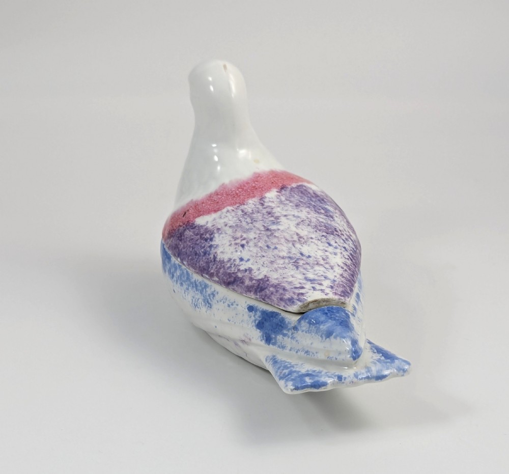 A late nineteenth-century Imperial Russian porcelain butter dish shaped as a seated bird with pink, purple, and blue stippled decoration. View III