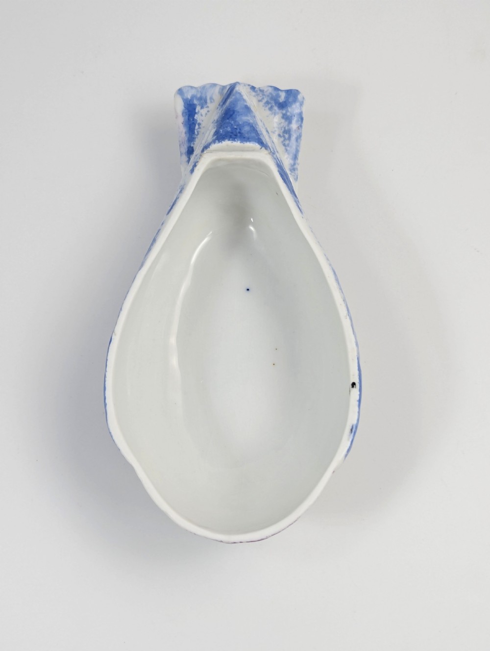 A late nineteenth-century Imperial Russian porcelain butter dish shaped as a seated bird with pink, purple, and blue stippled decoration. View VI