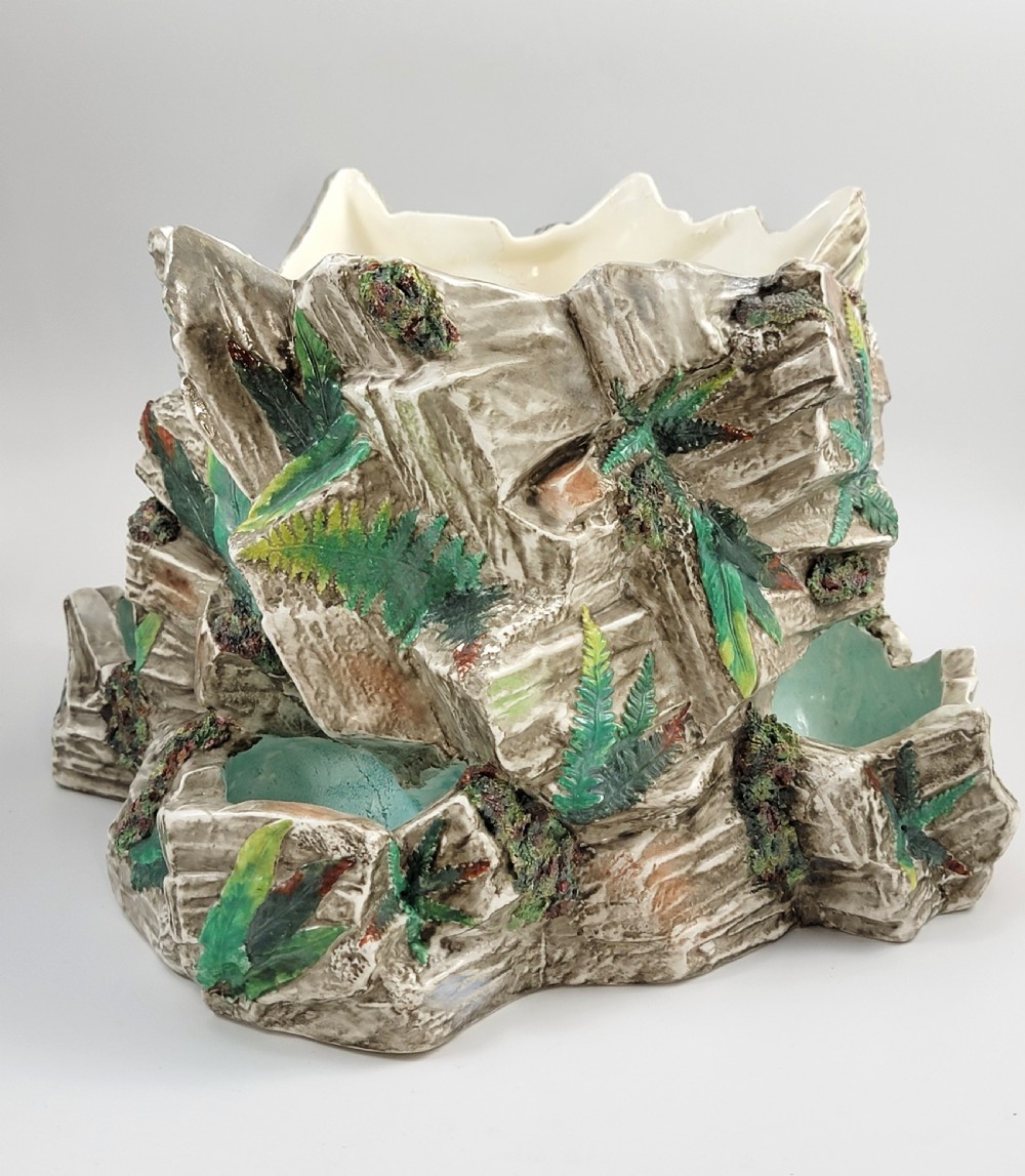 A Victorian Royal Worcester majolica ceramic jardiniere modelled as realistic rockwork with green fern fronds and moss detailing. View II