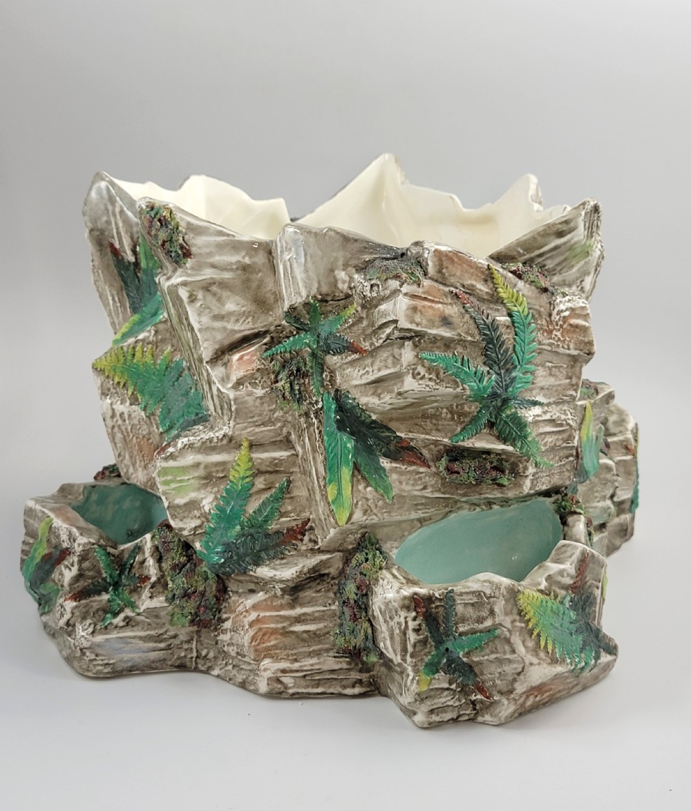 A Victorian Royal Worcester majolica ceramic jardiniere modelled as realistic rockwork with green fern fronds and moss detailing. View III