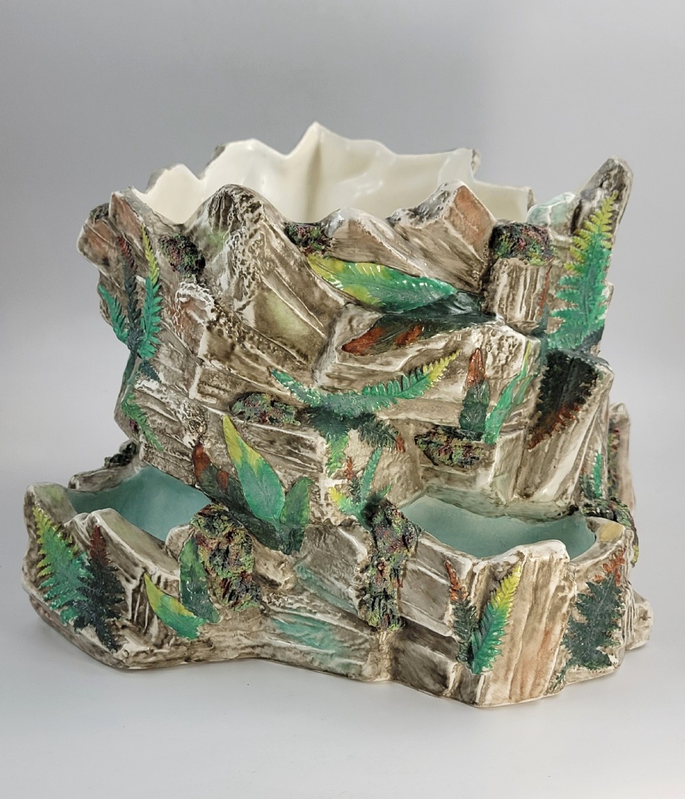 A Victorian Royal Worcester majolica ceramic jardiniere modelled as realistic rockwork with green fern fronds and moss detailing. View IV