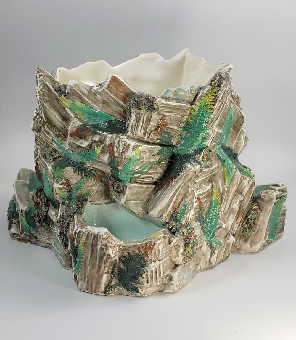 A Victorian Royal Worcester majolica ceramic jardiniere modelled as realistic rockwork with green fern fronds and moss detailing. View VI