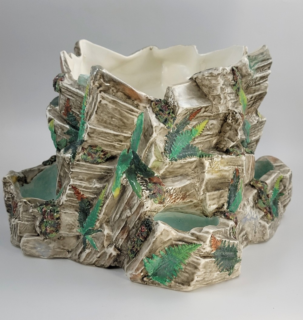A Victorian Royal Worcester majolica ceramic jardiniere modelled as realistic rockwork with green fern fronds and moss detailing. View VIII