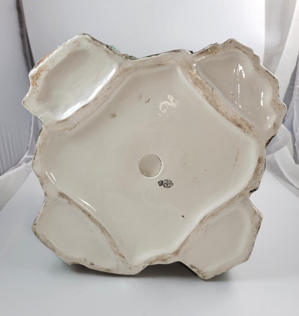A Victorian Royal Worcester majolica ceramic jardiniere modelled as realistic rockwork with green fern fronds and moss detailing. View XI