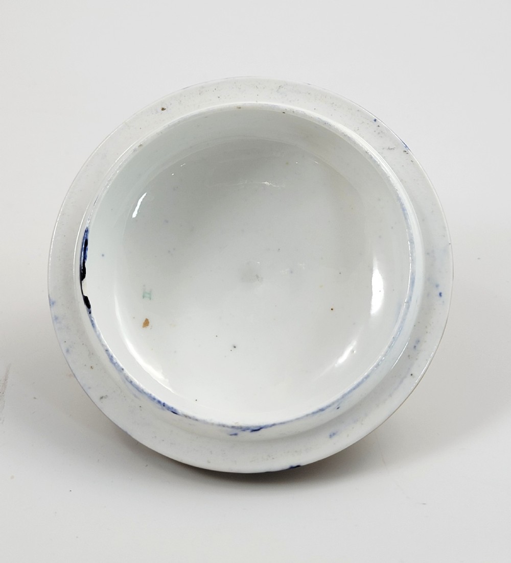 An antique porcelain chocolate cup and lid decorated with cobalt blue and gold Imari floral panels and raised white pearl borders. View IX