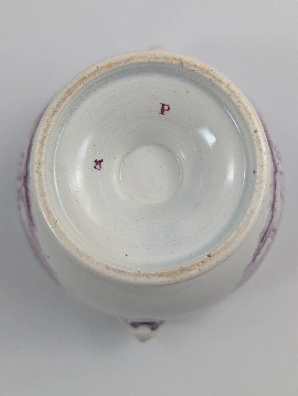 A 19th-century Staffordshire covered earthenware sugar bowl featuring a purple mulberry transferware romantic scene with lion mask handles and a pointed lid. View VIII