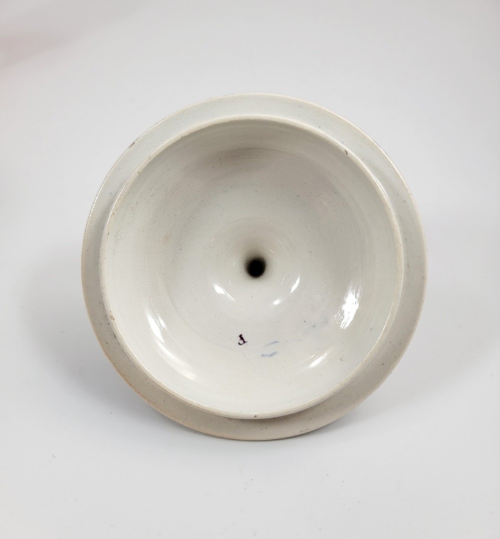 A 19th-century Staffordshire covered earthenware sugar bowl featuring a purple mulberry transferware romantic scene with lion mask handles and a pointed lid. View IX