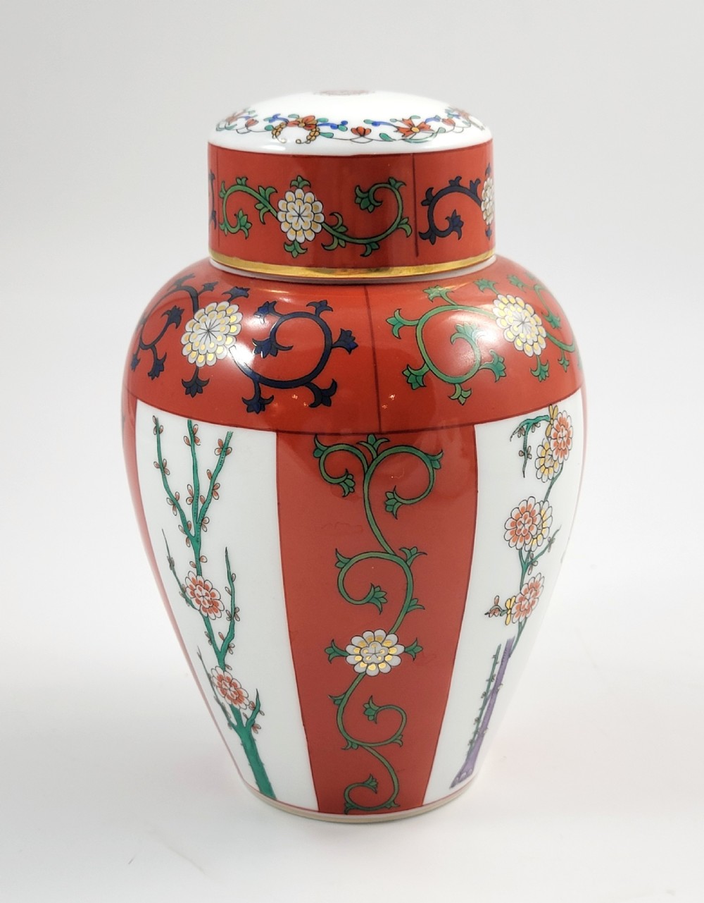 A hand-painted Herend porcelain tea caddy featuring vibrant red Siang Rouge panels, intricate floral vine motifs, and a matching domed lid. View II