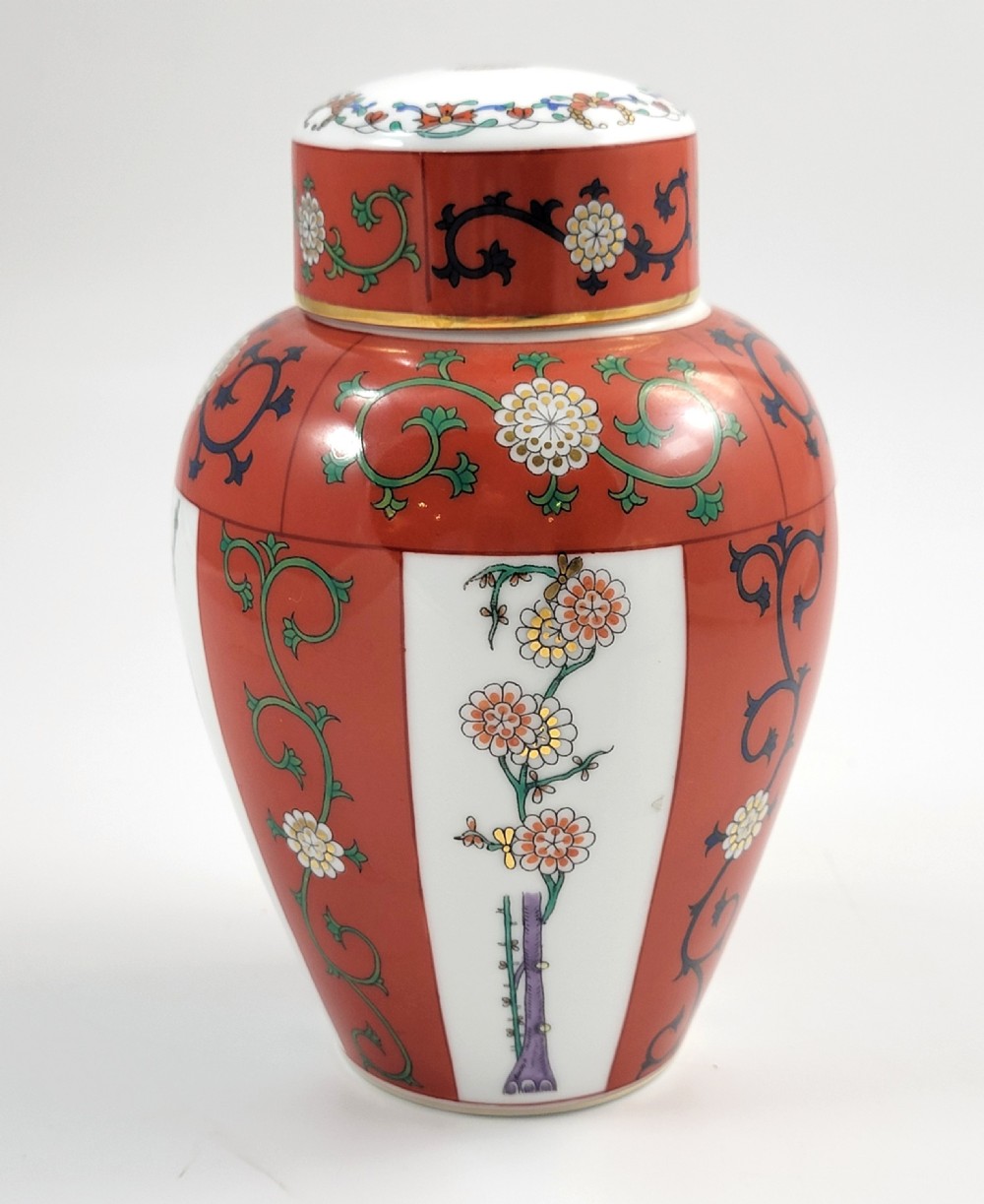 A hand-painted Herend porcelain tea caddy featuring vibrant red Siang Rouge panels, intricate floral vine motifs, and a matching domed lid. View III