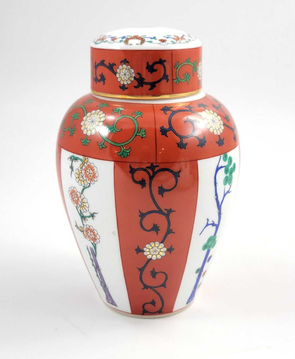A hand-painted Herend porcelain tea caddy featuring vibrant red Siang Rouge panels, intricate floral vine motifs, and a matching domed lid. View IV