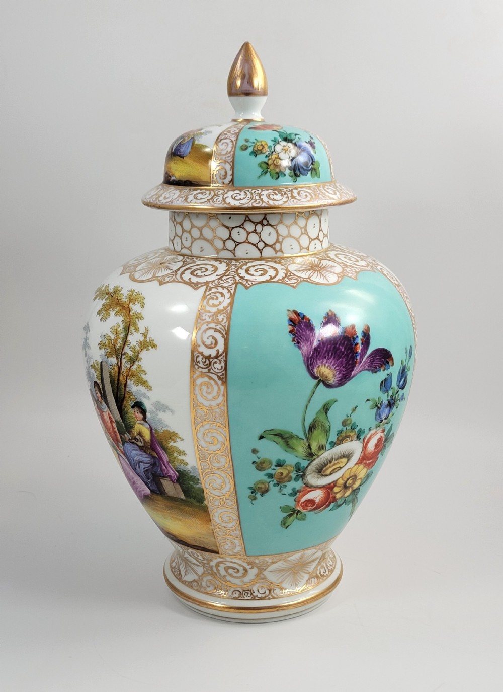 A 19th-century Dresden porcelain lidded vase featuring turquoise ground panels, gilded scrollwork, and hand-painted Watteau pastoral scenes. View II