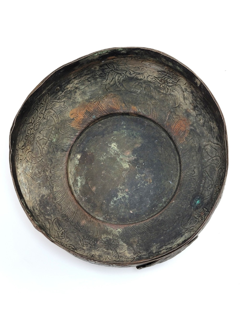 A patinated dark bronze Japanese bowl with carved archaic relief patterns and a key-fret border, resting on a carved wooden stand. View VIII