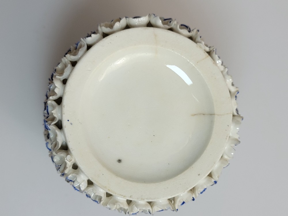A Victorian Royal Worcester porcelain scent bottle featuring encrusted white and blue forget-me-not flowers across the body and stopper, finished with gilded bands at the neck. View IX