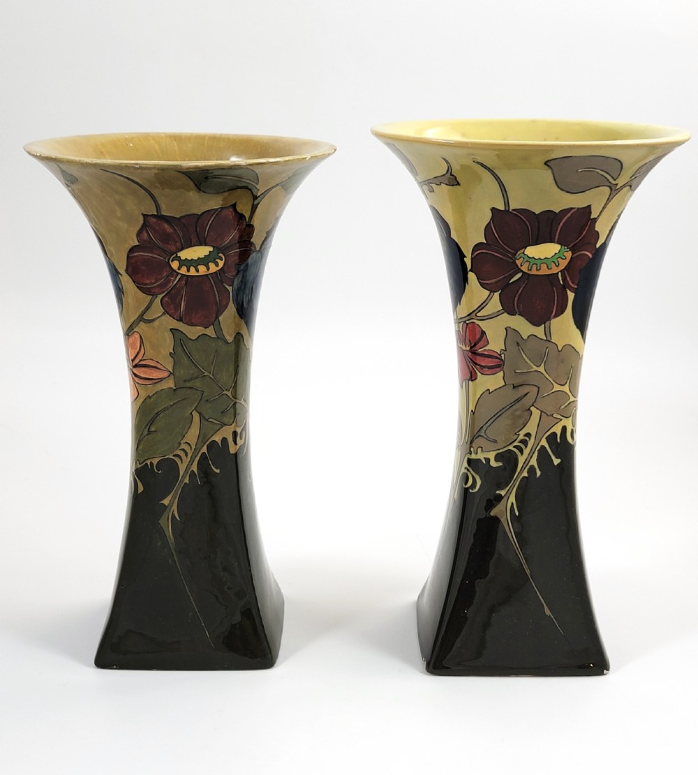 A pair of flared Art Nouveau porcelain vases featuring hand-painted birds perched on branches against a dark brown and yellow background. View II
