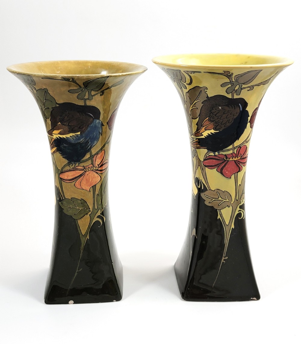 A pair of flared Art Nouveau porcelain vases featuring hand-painted birds perched on branches against a dark brown and yellow background. View III