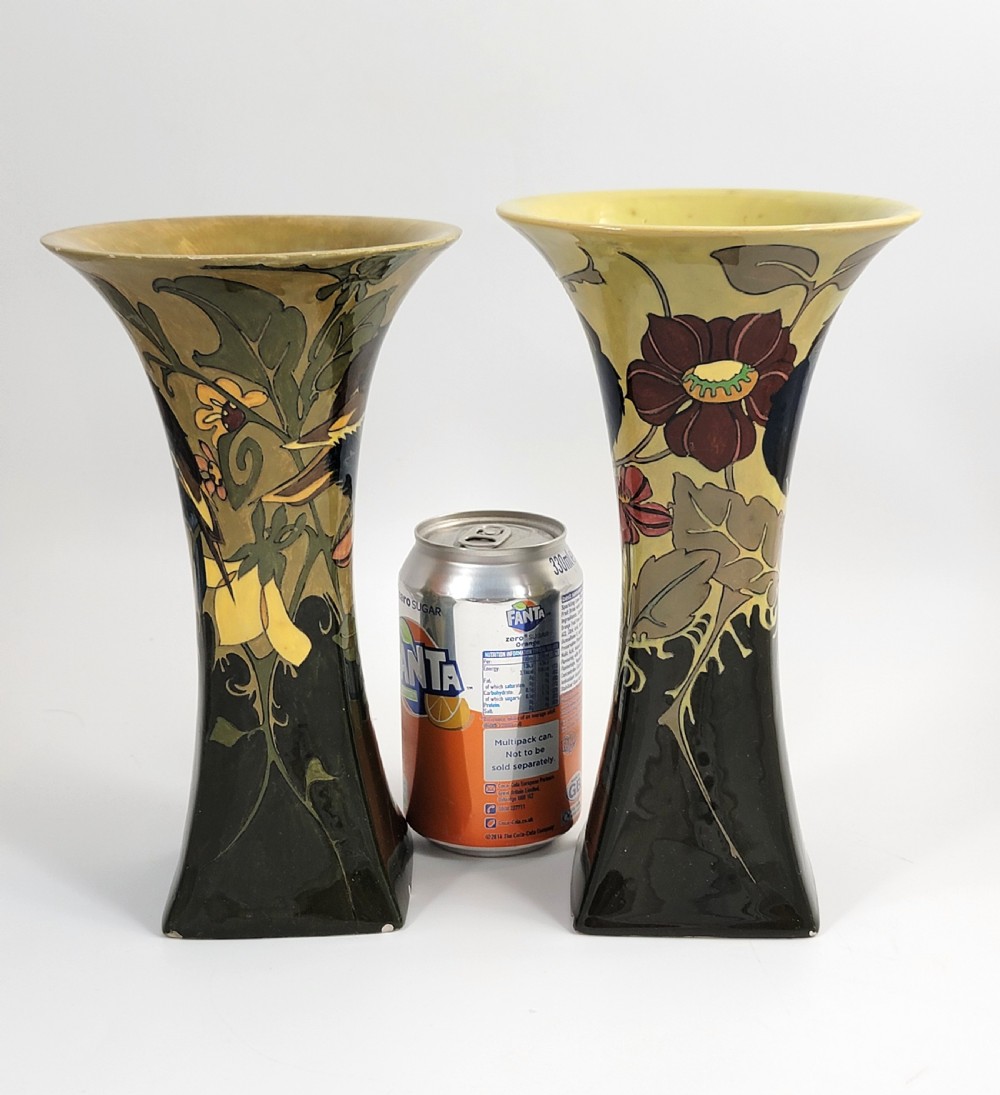 A pair of flared Art Nouveau porcelain vases featuring hand-painted birds perched on branches against a dark brown and yellow background. View IX