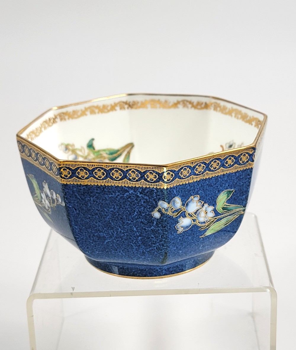 An octagonal Wedgwood lustre porcelain bowl featuring a blue mottled exterior adorned with hand-painted floral motifs and gilt borders. View III