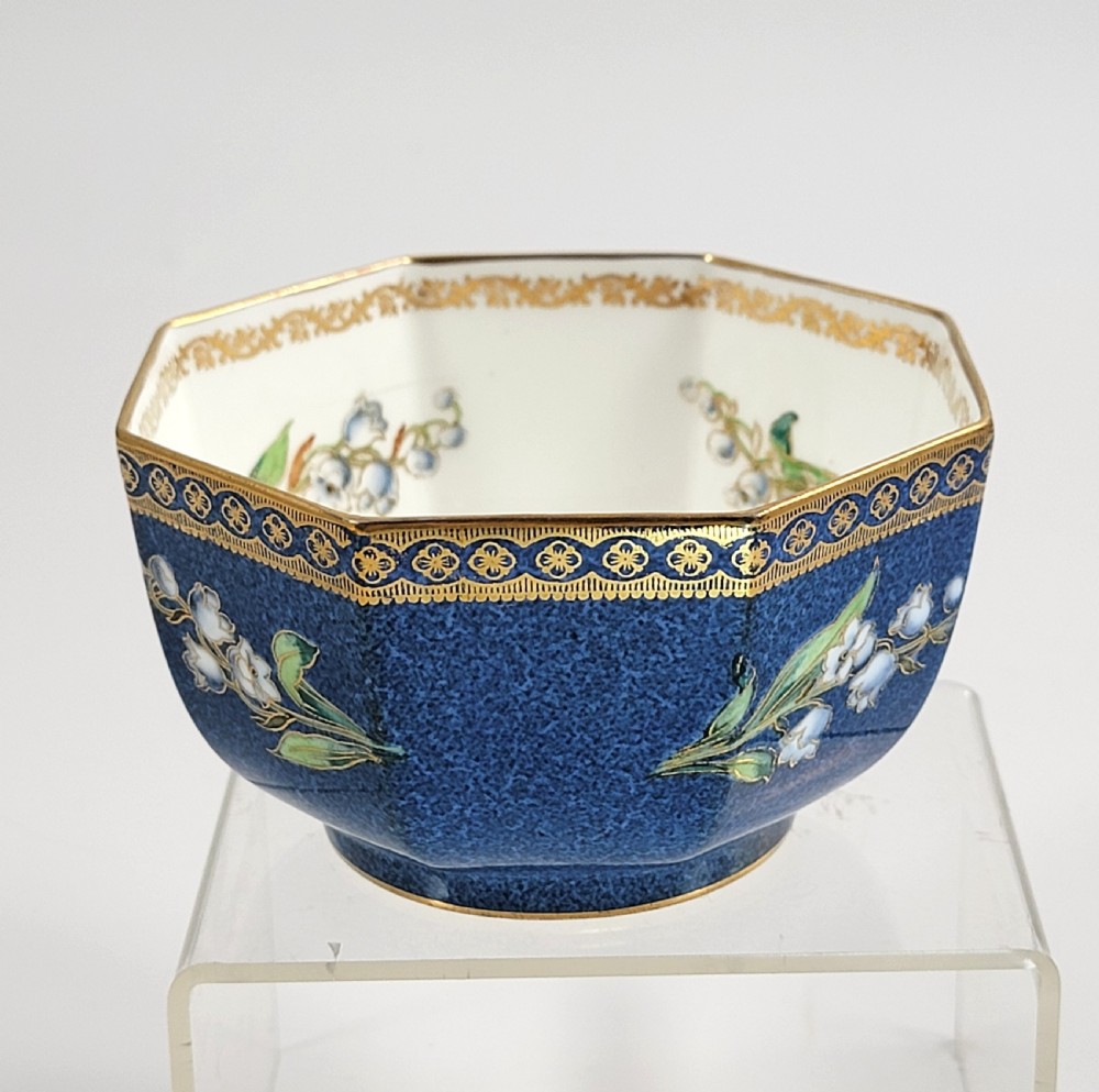 An octagonal Wedgwood lustre porcelain bowl featuring a blue mottled exterior adorned with hand-painted floral motifs and gilt borders. View IV