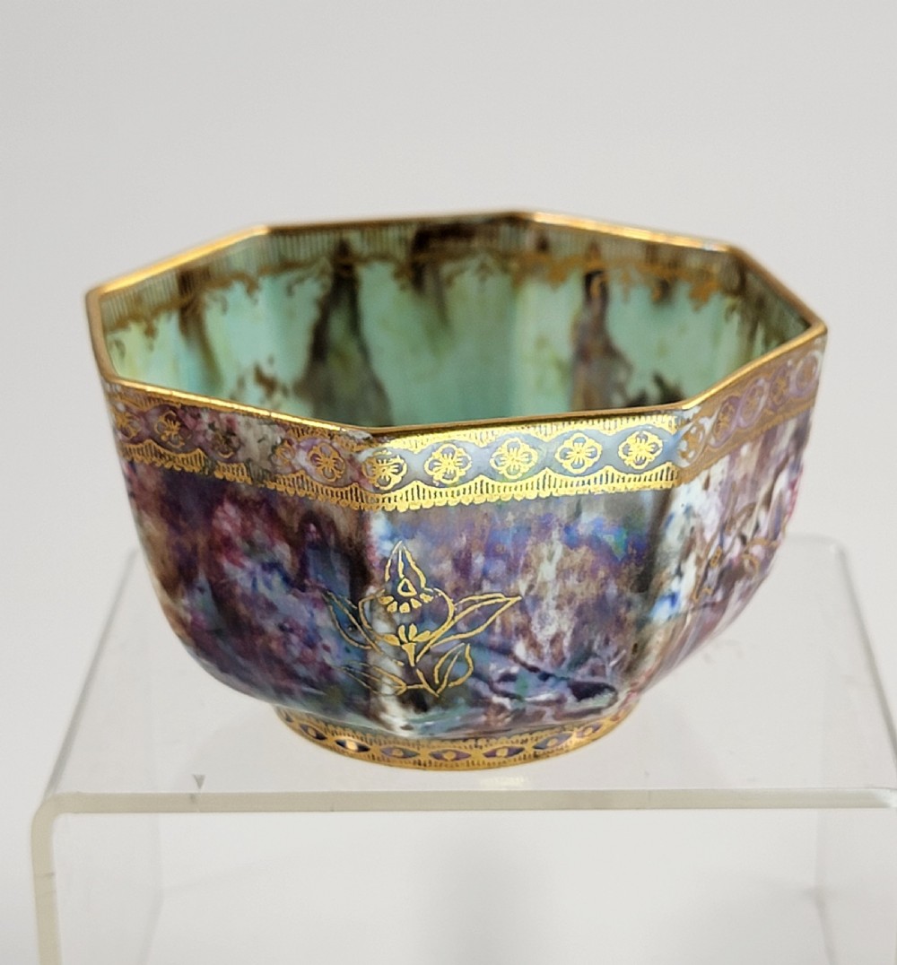 An octagonal antique Wedgwood lustre bowl featuring an iridescent purple exterior with gold gilded motifs and a pale green interior. View IV