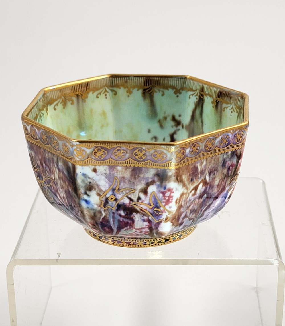 An octagonal antique Wedgwood lustre bowl featuring an iridescent purple exterior with gold gilded motifs and a pale green interior. View V