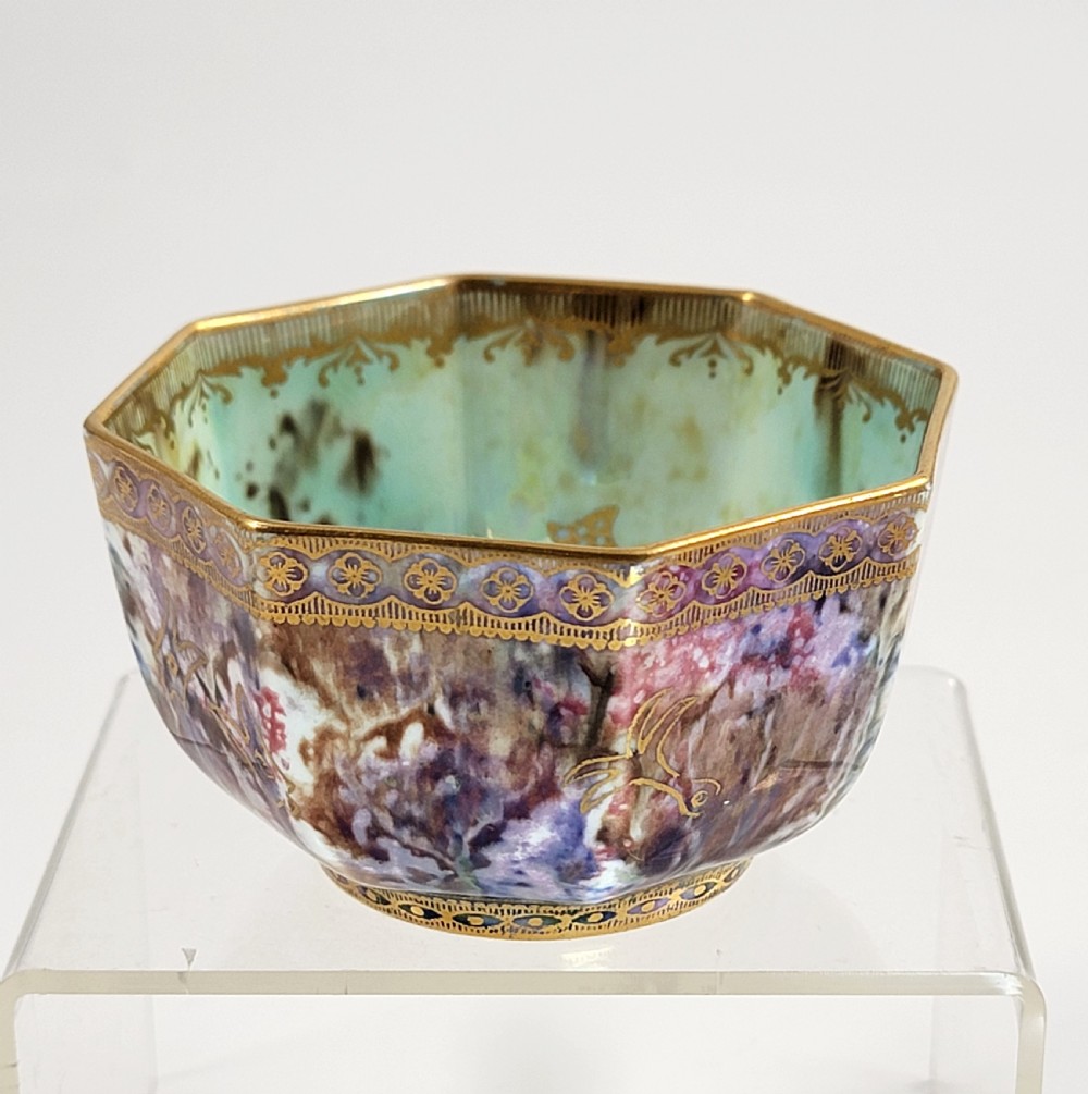 An octagonal antique Wedgwood lustre bowl featuring an iridescent purple exterior with gold gilded motifs and a pale green interior. View VI