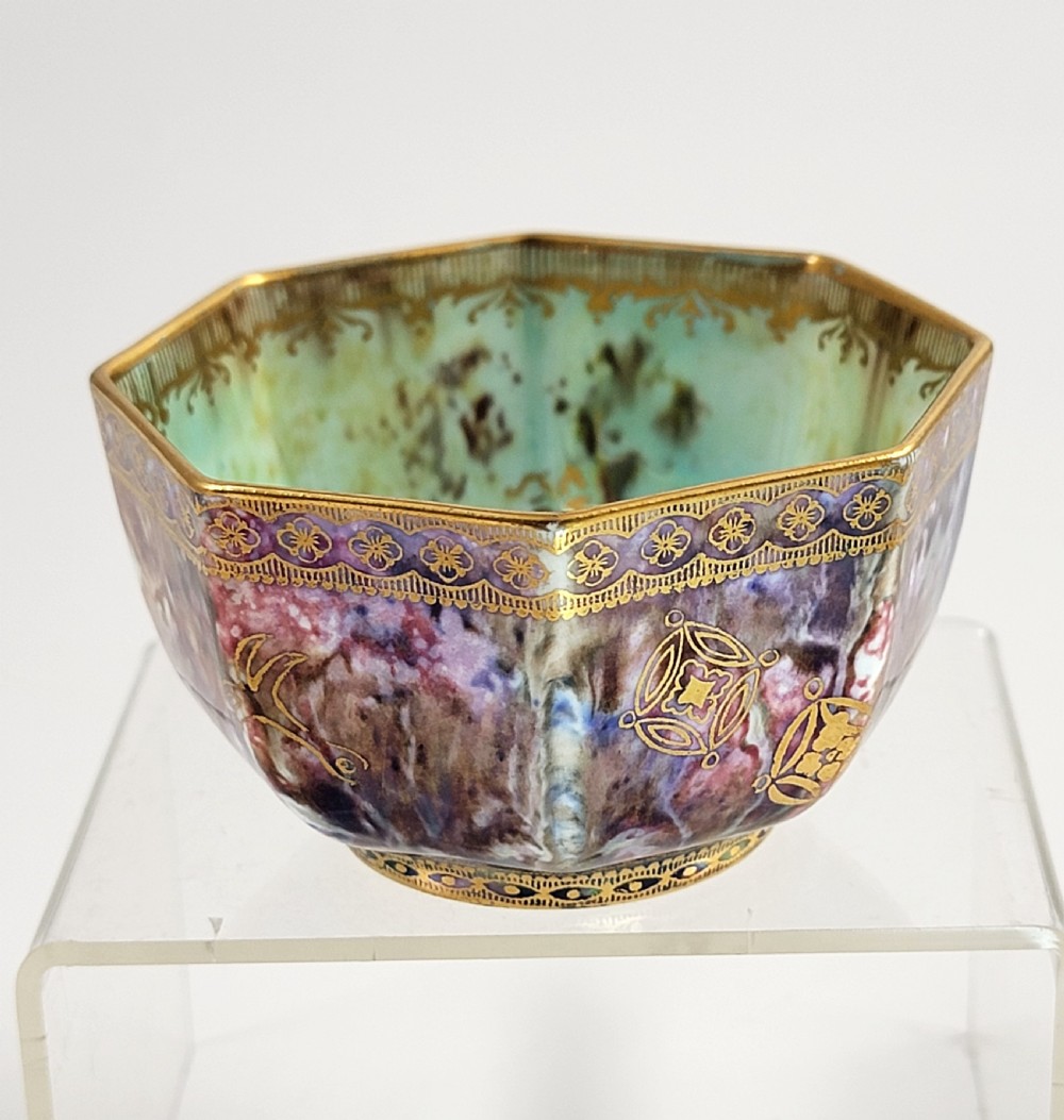 An octagonal antique Wedgwood lustre bowl featuring an iridescent purple exterior with gold gilded motifs and a pale green interior. View VII