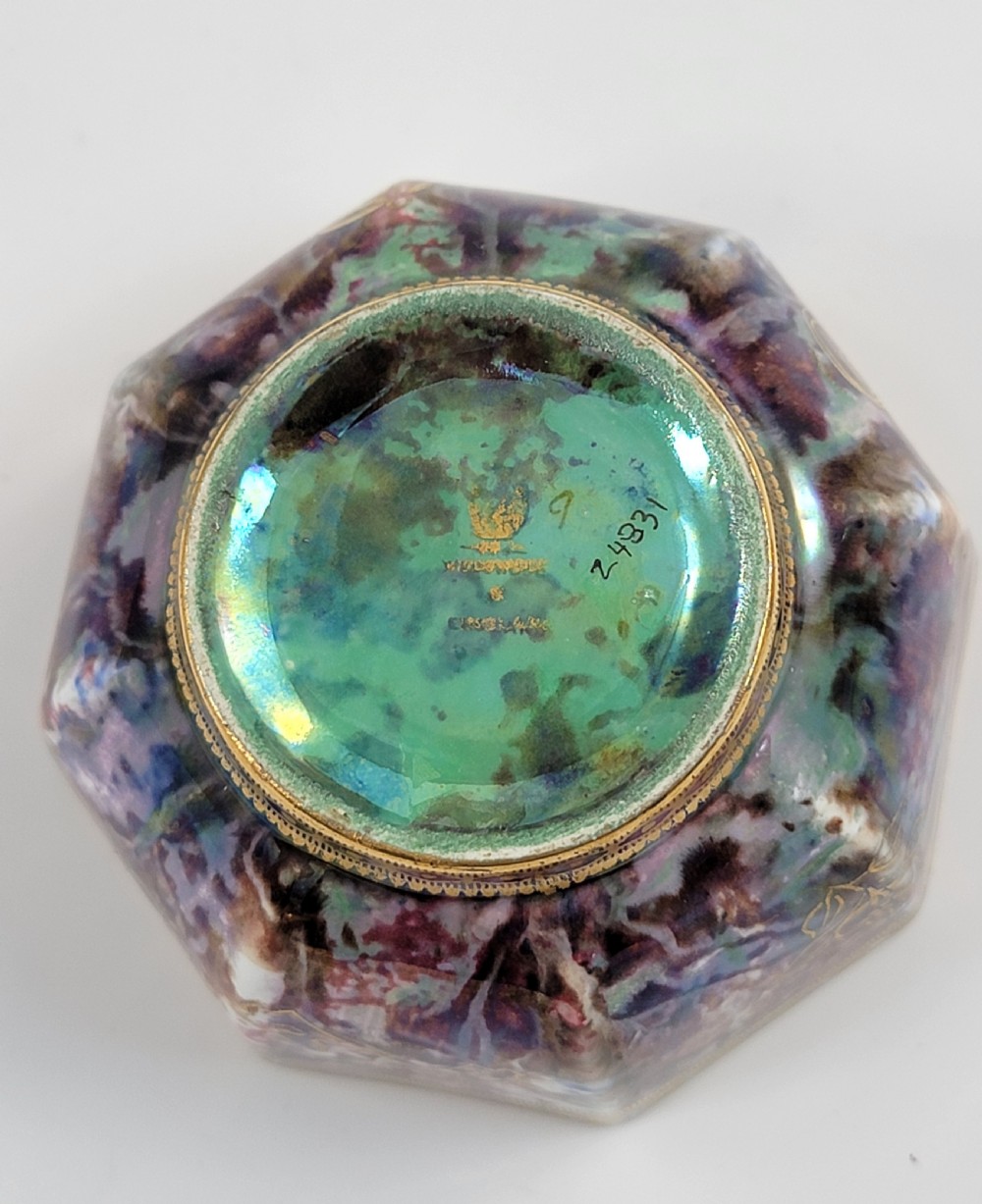 An octagonal antique Wedgwood lustre bowl featuring an iridescent purple exterior with gold gilded motifs and a pale green interior. View X