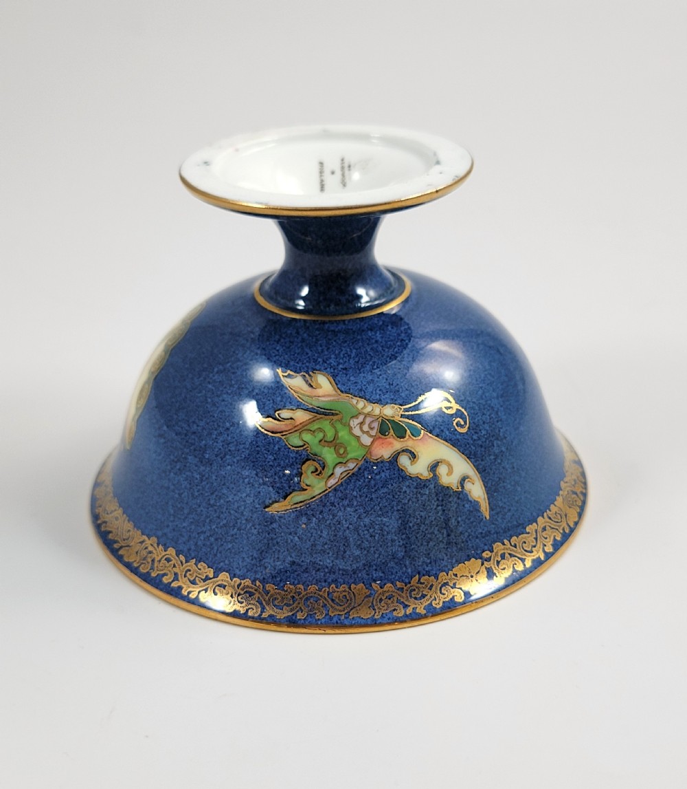 A footed Wedgwood porcelain bowl featuring a deep blue mottled exterior embellished with a gilded butterfly and an iridescent pearlescent interior with gold trim. View XII