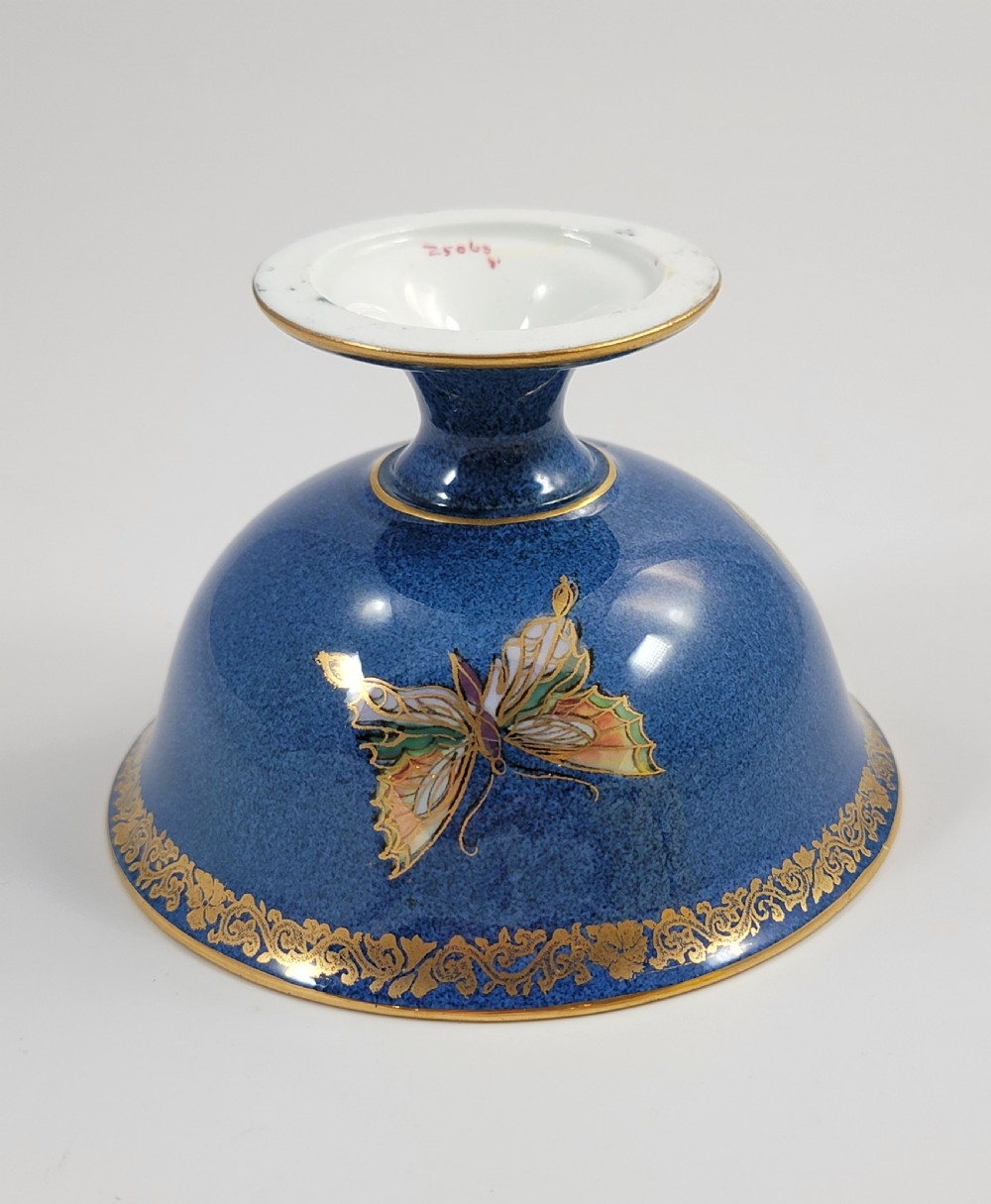 A footed Wedgwood porcelain bowl featuring a deep blue mottled exterior embellished with a gilded butterfly and an iridescent pearlescent interior with gold trim. View XIII
