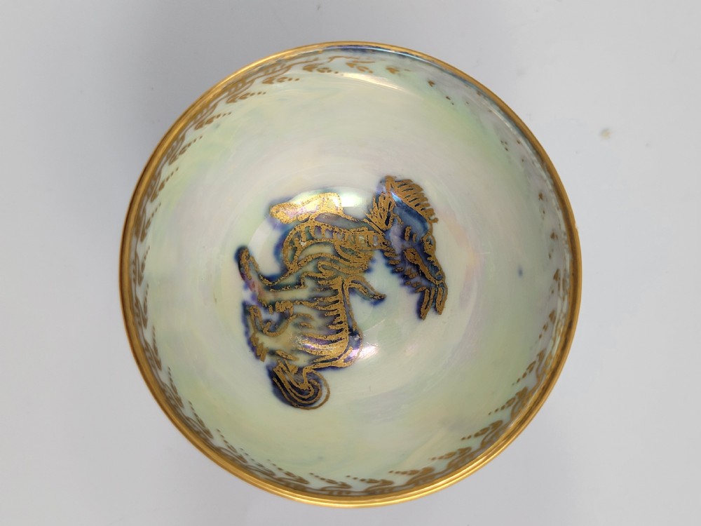 A miniature Wedgwood lustre porcelain cup featuring a cobalt blue iridescent exterior decorated with gilded dragon motifs and a pale iridescent green interior. View VIII