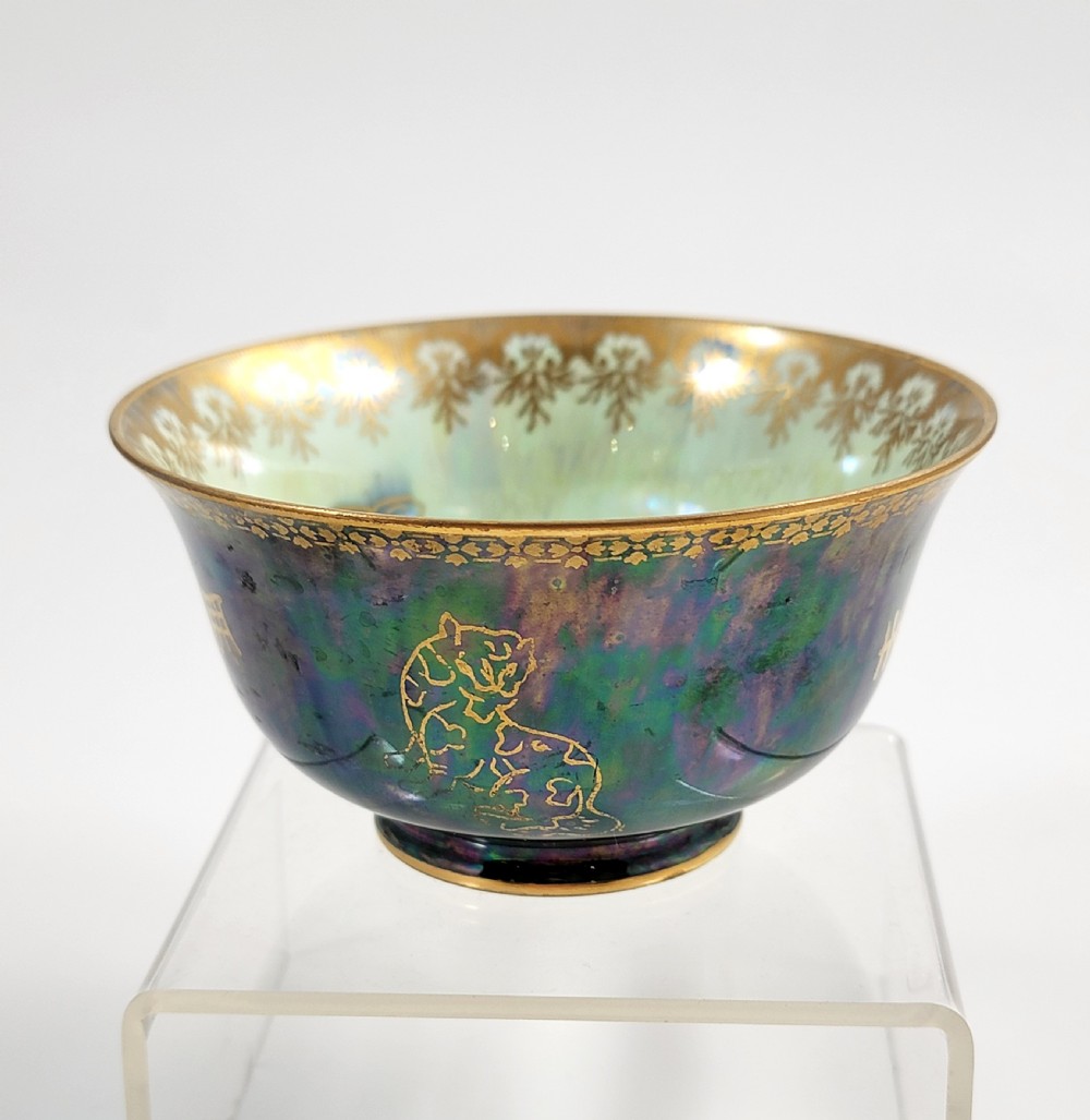 An antique footed porcelain bowl featuring iridescent purple and green glazes decorated with gilt dragons and ornamental borders. View III