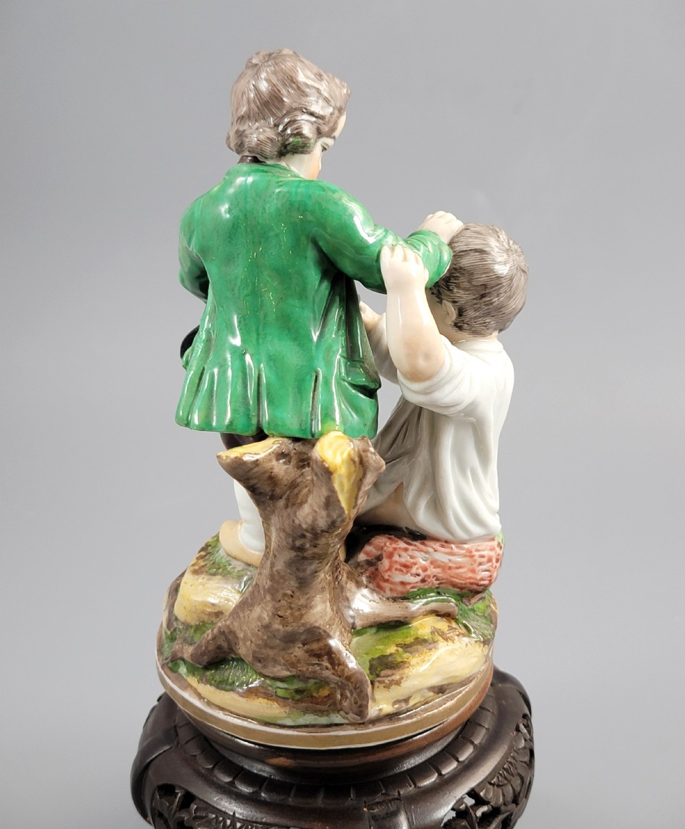 A French Niderviller porcelain figure group depicting two young boys on a rocky naturalistic base. View VI