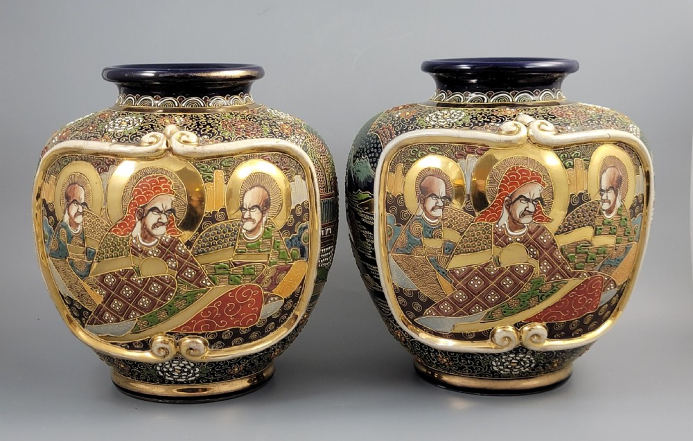 A pair of bulbous Japanese Satsuma earthenware vases decorated with raised moriage enamel and gilding depicting Buddhist figures. View III