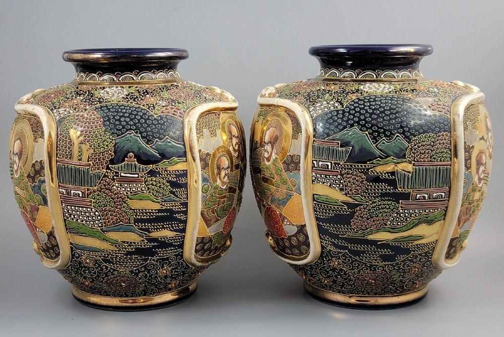 A pair of bulbous Japanese Satsuma earthenware vases decorated with raised moriage enamel and gilding depicting Buddhist figures. View IV