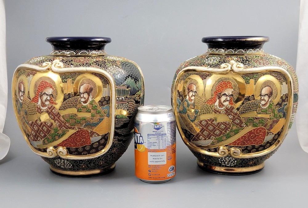 A pair of bulbous Japanese Satsuma earthenware vases decorated with raised moriage enamel and gilding depicting Buddhist figures. View XI