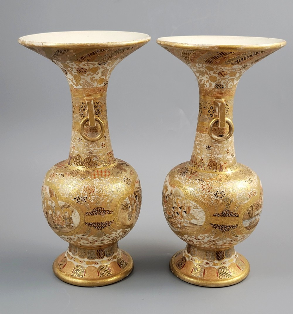 A pair of Japanese Satsuma earthenware vases featuring flared rims, fixed ring handles, and detailed hand-painted figural panels with extensive gold gilding. View III