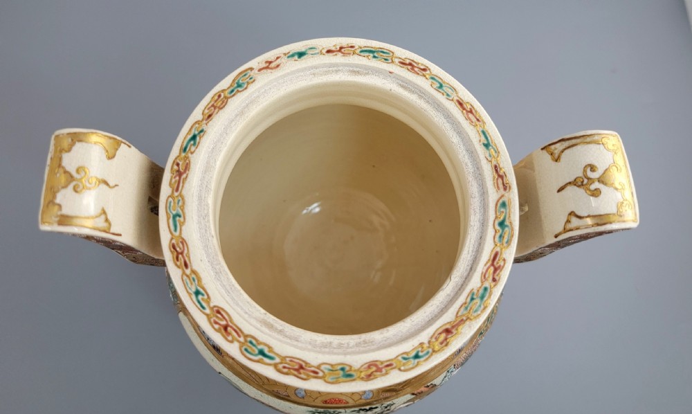 A cream-coloured Japanese Satsuma earthenware incense burner featuring a lid with a shishi lion finial, upright handles, tripod feet, and detailed polychrome paintings of samurai warriors with gold accents. View XIV