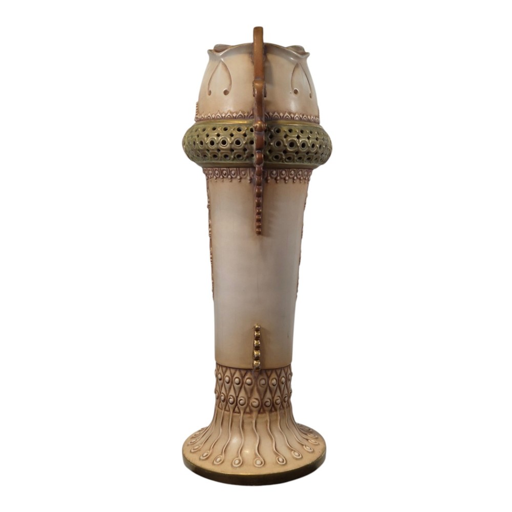 A tall Art Nouveau ceramic vase featuring a cream glaze body, brown reticulated handles, geometric relief beadwork, and a flared pedestal base. View IV