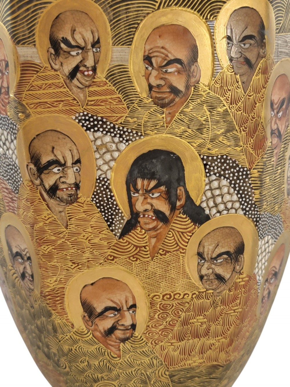 A tall gilded Japanese Satsuma earthenware vase painted with figures of Arhats and a dragon, set on a dark wooden base. View XIV