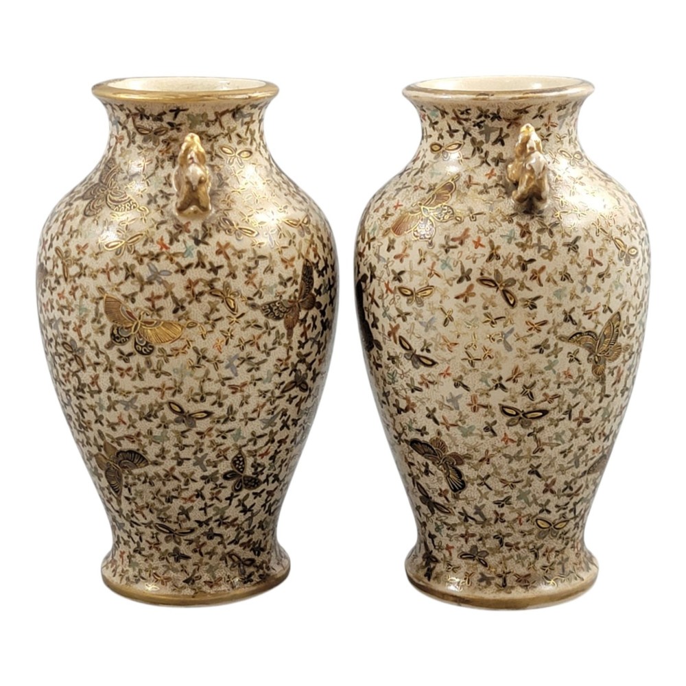 A pair of baluster-shaped Japanese Satsuma earthenware vases decorated with a dense pattern of polychrome butterflies and gold lion-dog side handles. View XII
