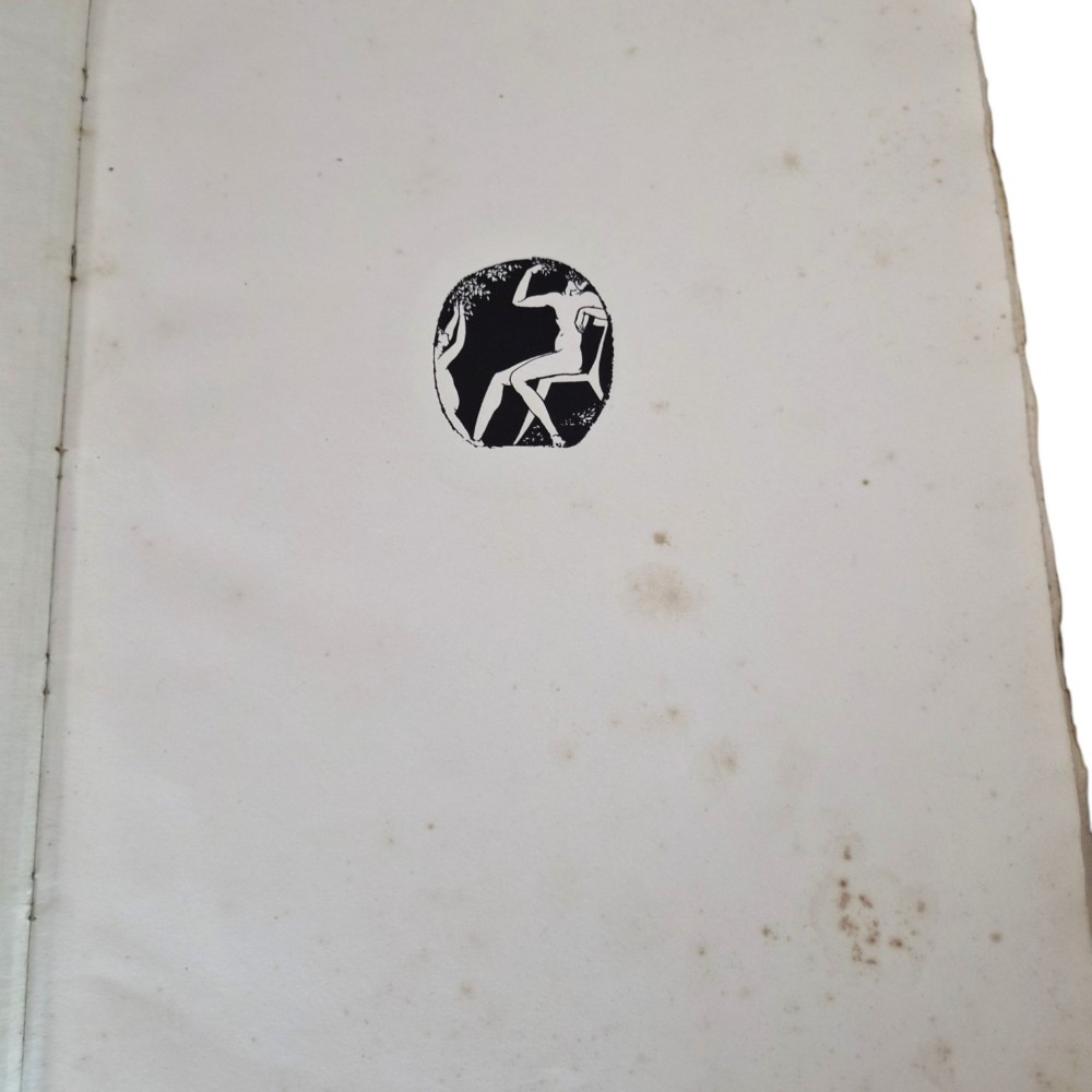 The spine of an antique hardcover book featuring intricate gilt floral patterns and lettered text reading The Story of Leon Baksts Life by Andre Levinson. View IX