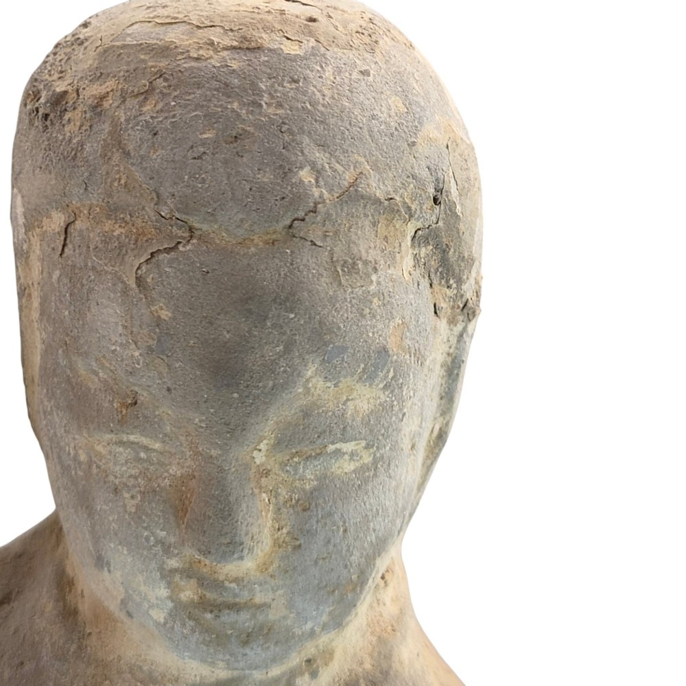 An ancient grey earthenware figure of a dancer in an S-shaped posture with one arm raised and an unglazed finish. View VIII