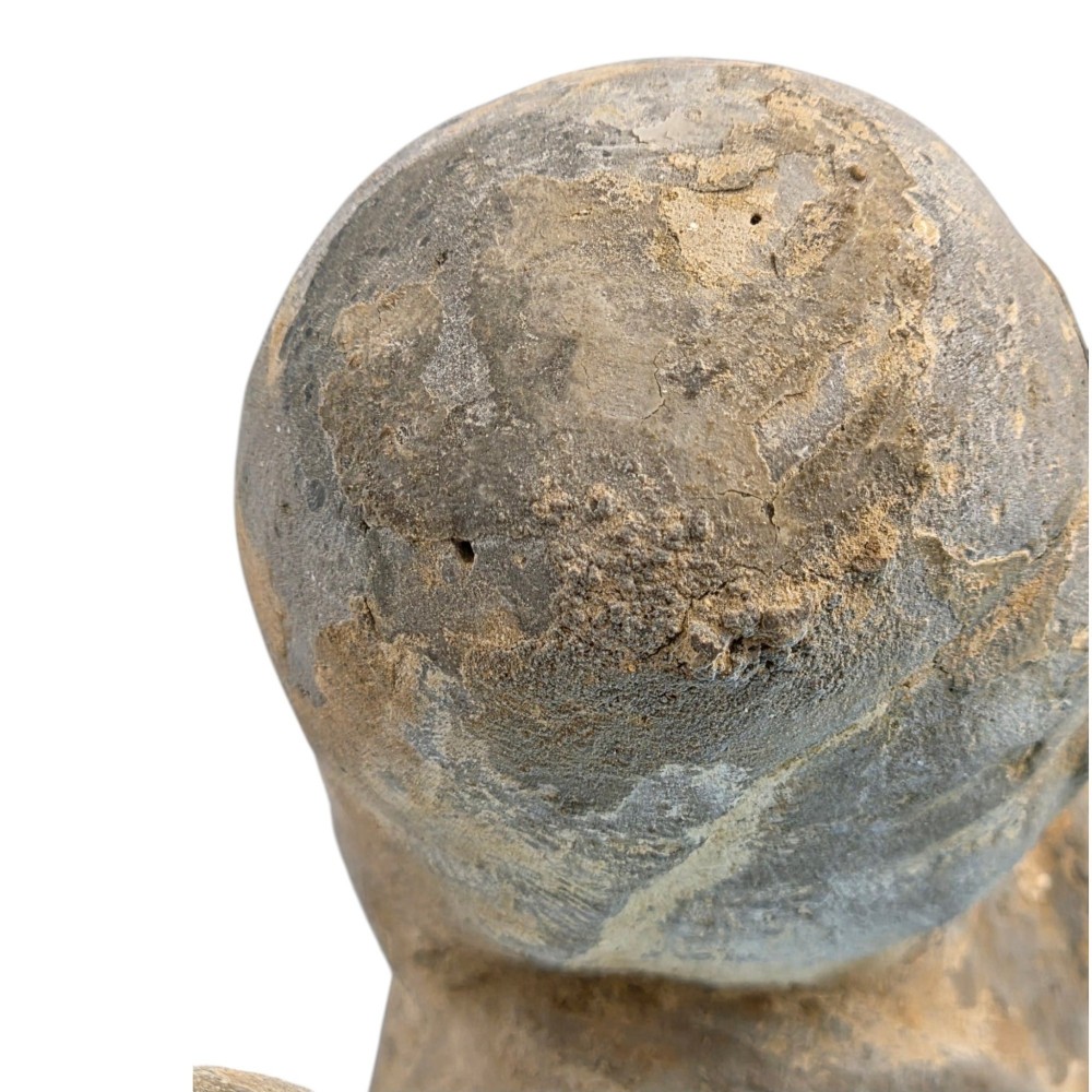 An ancient grey earthenware figure of a dancer in an S-shaped posture with one arm raised and an unglazed finish. View X