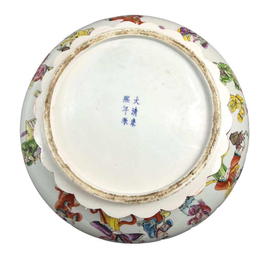 A late Qing dynasty Chinese Famille Rose porcelain dish featuring a hand-painted central figure, lotus blossoms, butterflies, and a distinct red castellated rim. View VII