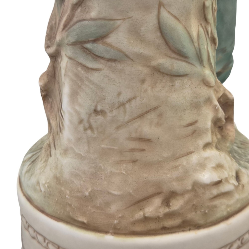 A pair of Royal Dux Art Nouveau porcelain figurines depicting classical maidens with winged cherubs and openwork baskets. View VII