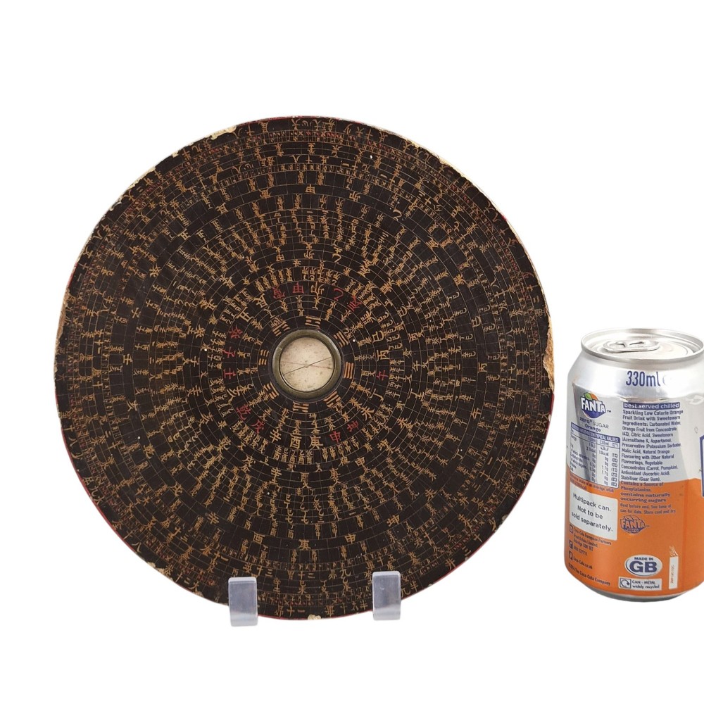 A circular antique Chinese Luopan geomantic compass crafted from dark lacquered wood featuring multiple concentric rings of gilded Chinese characters and a central brass magnetic dial. View XI