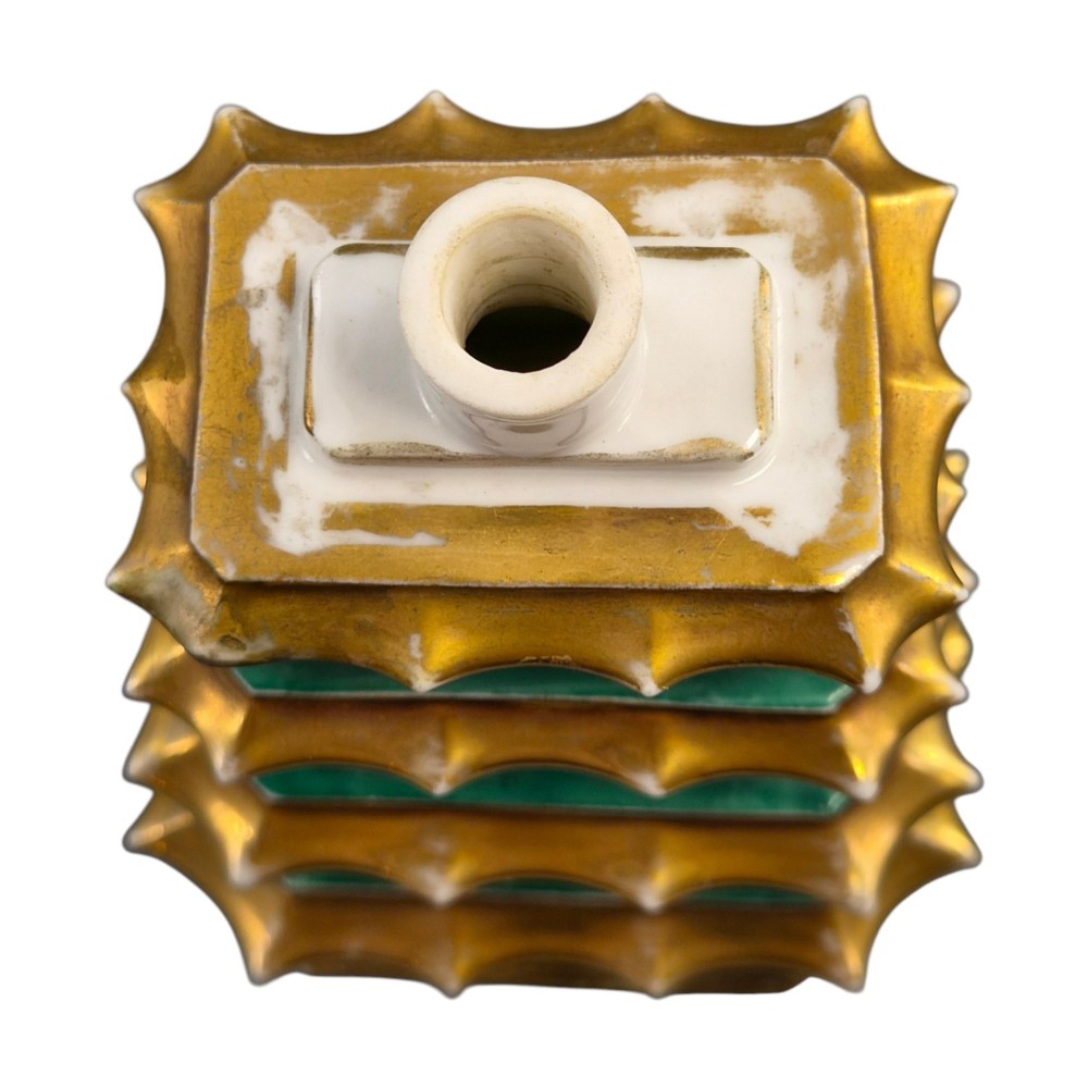 A multi-tiered green and gold porcelain pagoda-shaped perfume bottle featuring hand-painted floral cartouches on each section. View VII