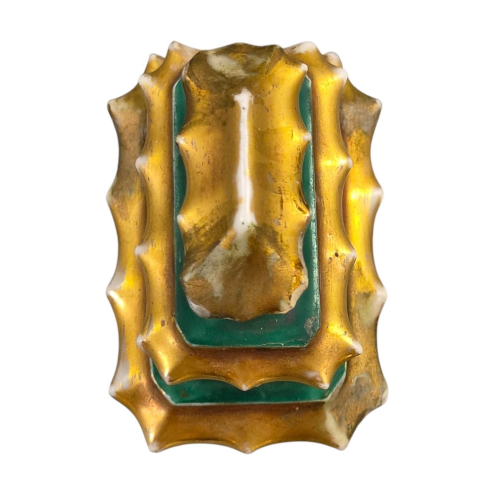 A multi-tiered green and gold porcelain pagoda-shaped perfume bottle featuring hand-painted floral cartouches on each section. View IX