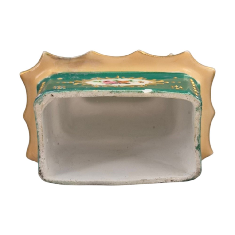 A multi-tiered green and gold porcelain pagoda-shaped perfume bottle featuring hand-painted floral cartouches on each section. View XI